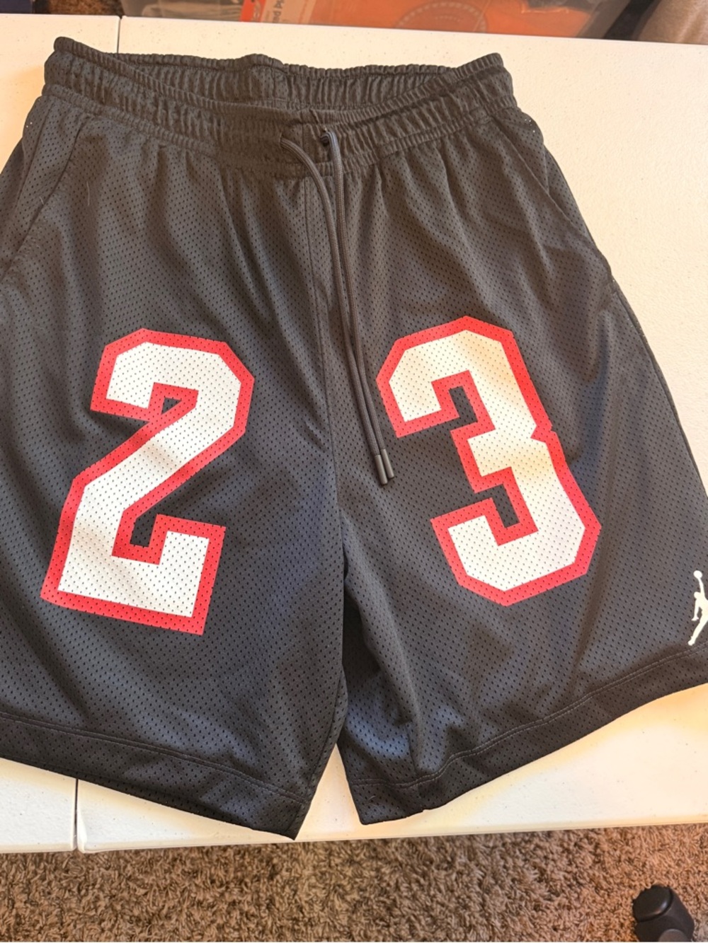 Jordan Men's Black Athletic Shorts with Red & White Number Graphics